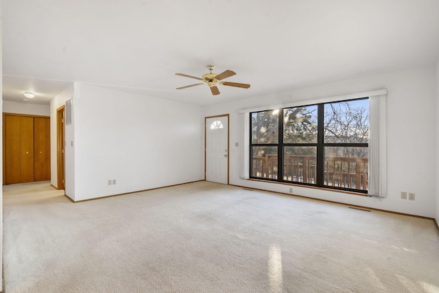 carpeted empty room with ceiling fan