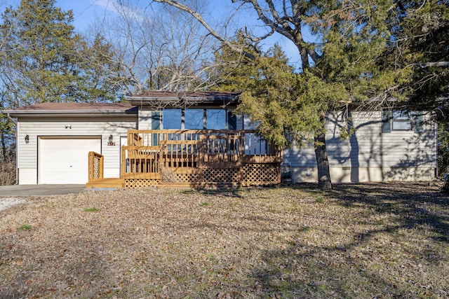 exterior space featuring a garage and a deck