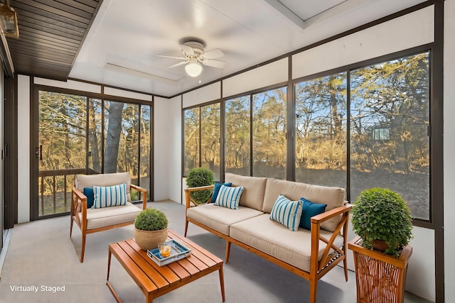 sunroom featuring ceiling fan