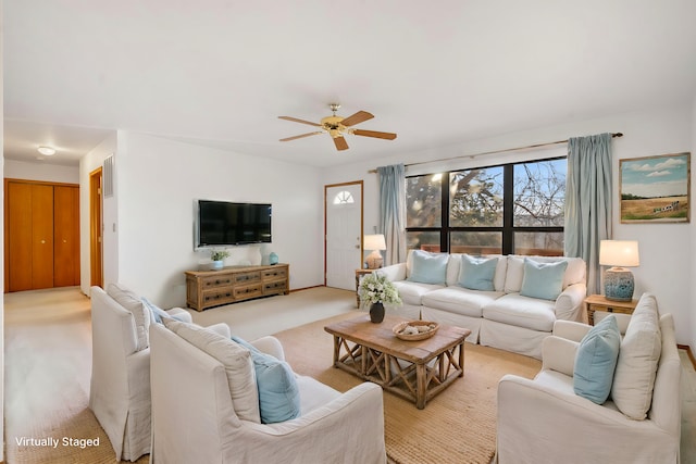 living room with light carpet and ceiling fan