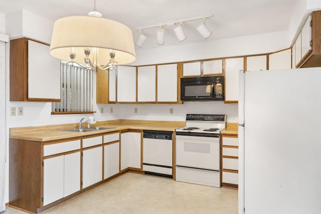 kitchen with a notable chandelier, sink, white appliances, hanging light fixtures, and white cabinets