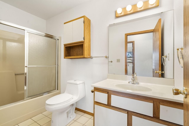 full bathroom with toilet, tile patterned floors, vanity, and shower / bath combination with glass door