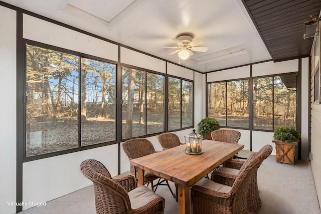 sunroom / solarium featuring ceiling fan