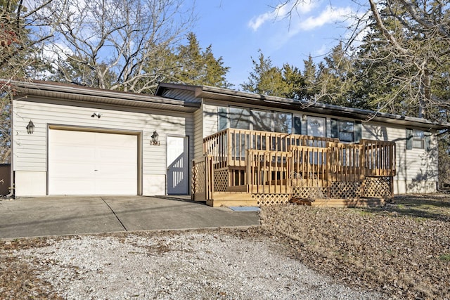 view of front of house with a garage and a deck