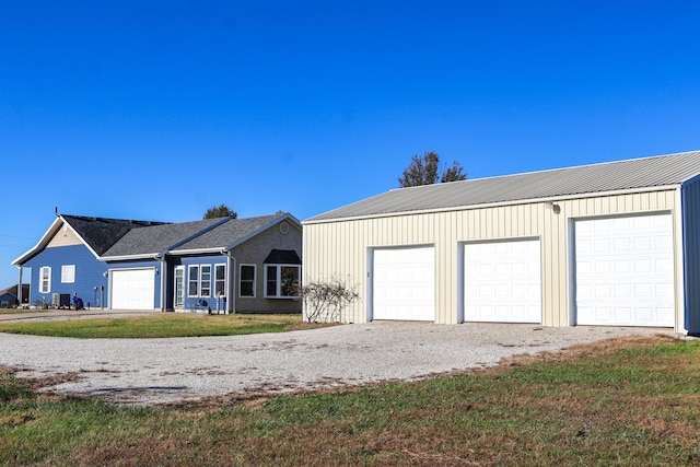 view of front of house with a garage and a front yard