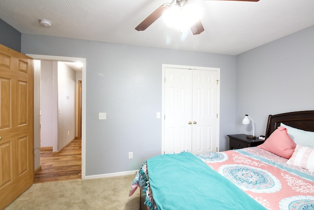 carpeted bedroom with ceiling fan