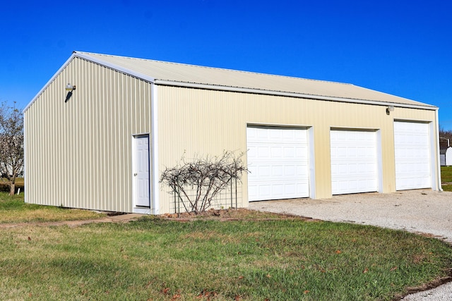 garage featuring a yard