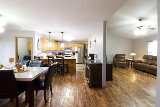 dining room featuring ceiling fan and dark hardwood / wood-style floors