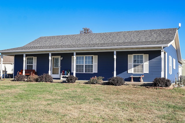 single story home with covered porch and a front yard