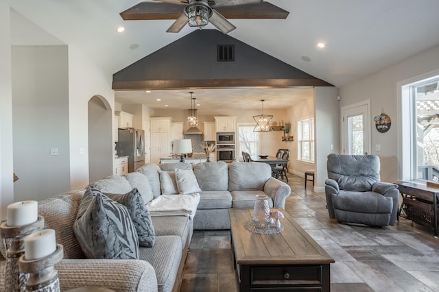 living room featuring visible vents, baseboards, recessed lighting, arched walkways, and a ceiling fan