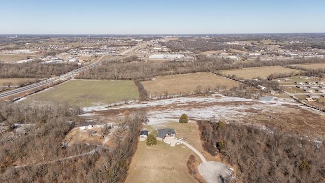 birds eye view of property featuring a rural view