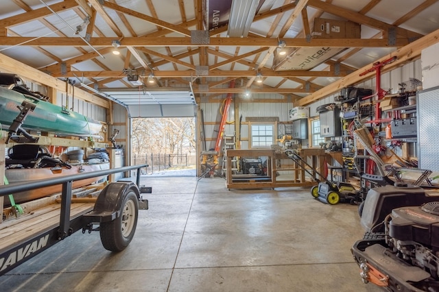 garage with a garage door opener and metal wall