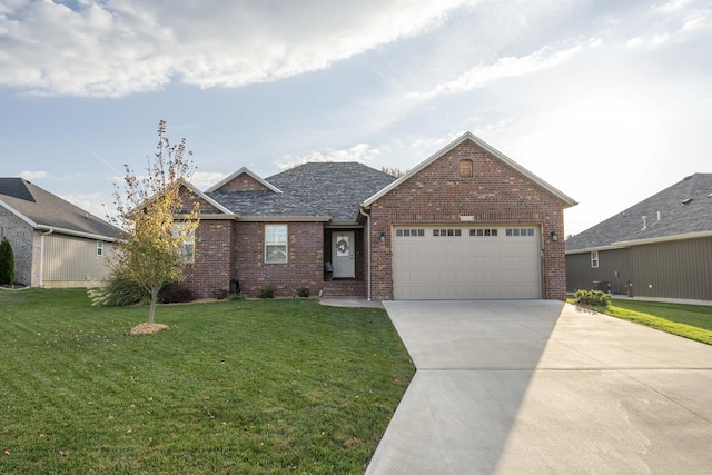 view of front of property featuring a garage and a front yard