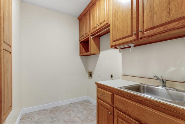 clothes washing area with cabinets, hookup for a washing machine, sink, and electric dryer hookup