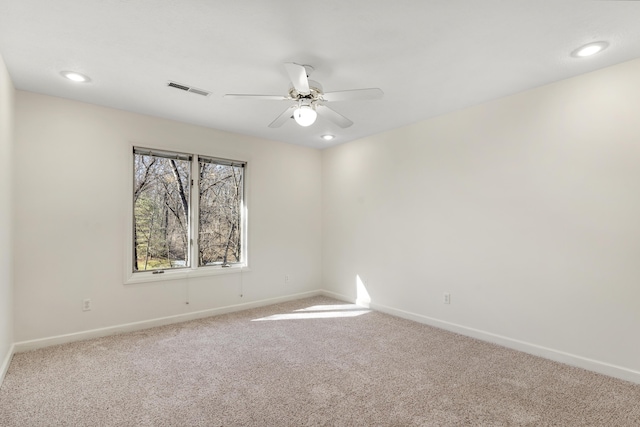 empty room with carpet floors and ceiling fan