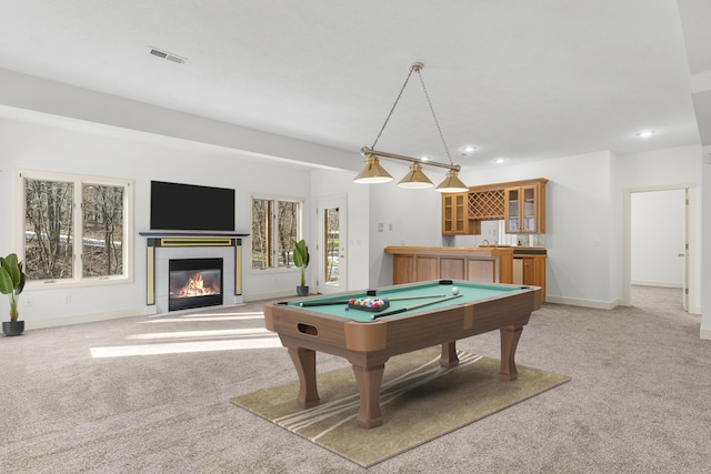 recreation room featuring a tiled fireplace, carpet floors, billiards, and indoor bar