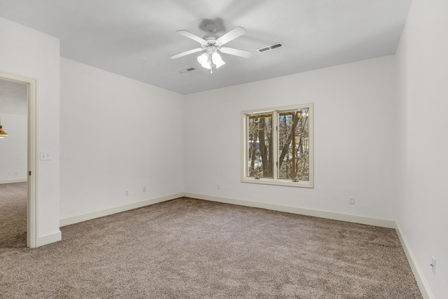 carpeted empty room with ceiling fan