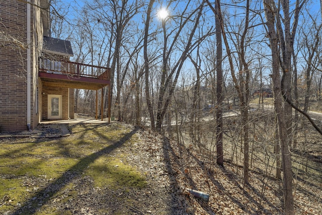 view of yard featuring a wooden deck