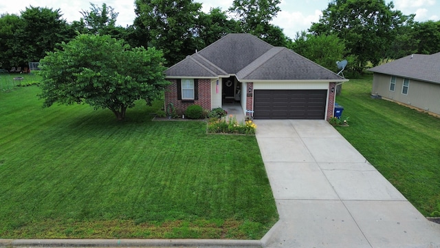 ranch-style home with a garage and a front yard