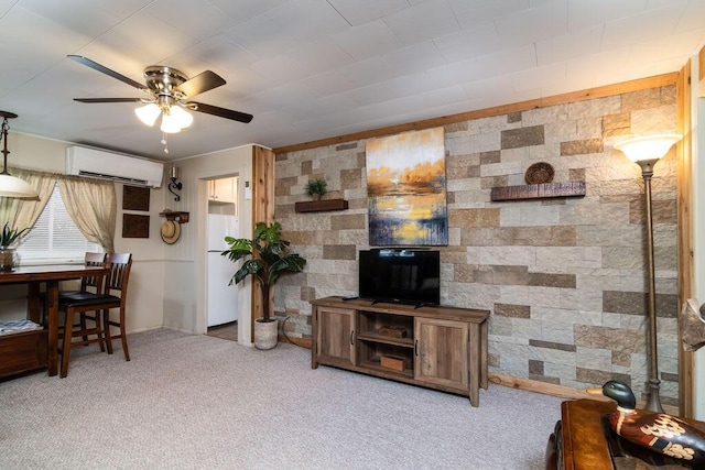 carpeted living room with a wall mounted air conditioner and ceiling fan