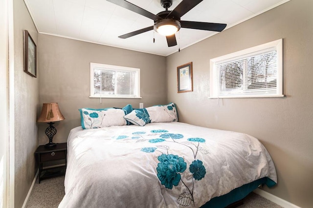 bedroom featuring ornamental molding, carpet, and ceiling fan