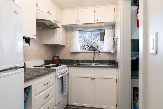 kitchen featuring tasteful backsplash, white cabinetry, sink, and white appliances