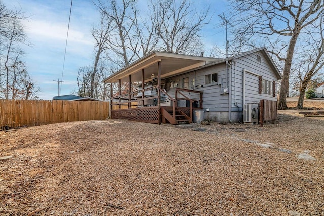 view of front of house with ac unit and a deck