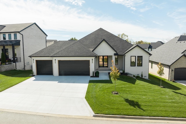 modern farmhouse style home featuring a garage and a front yard