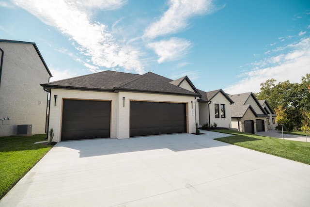 view of front of property featuring a front lawn, central air condition unit, and a garage