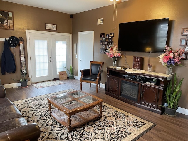 living room featuring wood-type flooring and french doors