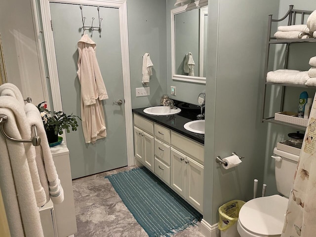 bathroom with toilet and vanity