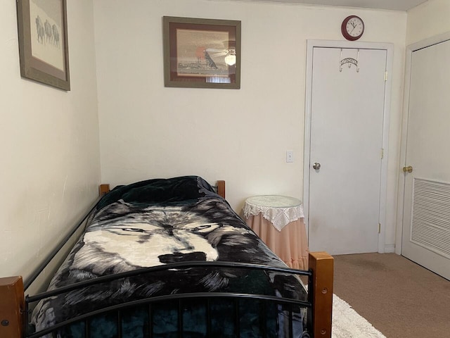 bedroom with carpet and a closet