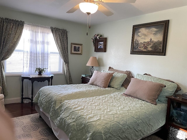 bedroom featuring ceiling fan and hardwood / wood-style floors