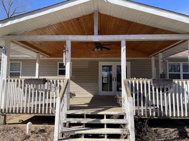 doorway to property featuring ceiling fan, a porch, and french doors