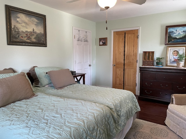 bedroom with ceiling fan and hardwood / wood-style flooring