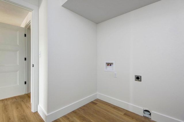 laundry area featuring washer hookup, hookup for an electric dryer, baseboards, and wood finished floors