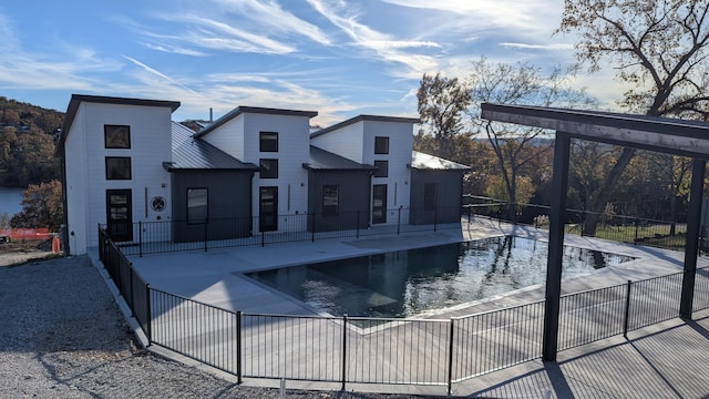 view of pool featuring a patio area, fence, and a fenced in pool