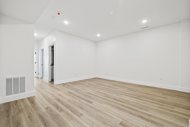 spare room with light wood-type flooring