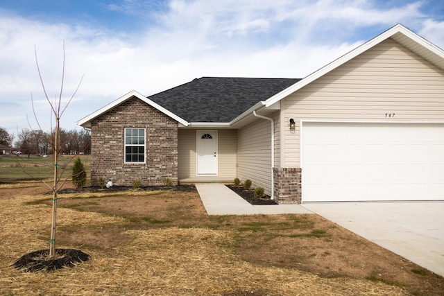 ranch-style house with a garage and a front yard