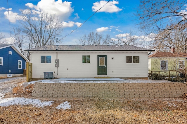 rear view of property featuring central AC unit and a patio