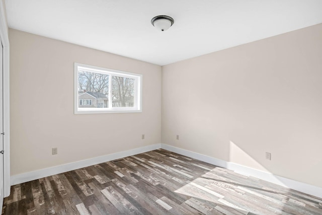 empty room with hardwood / wood-style floors