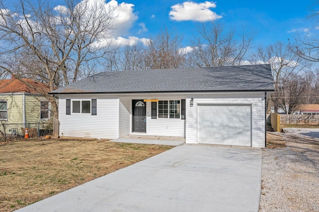 single story home with a garage and a front lawn