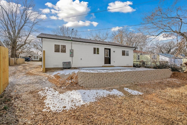 back of house with central AC