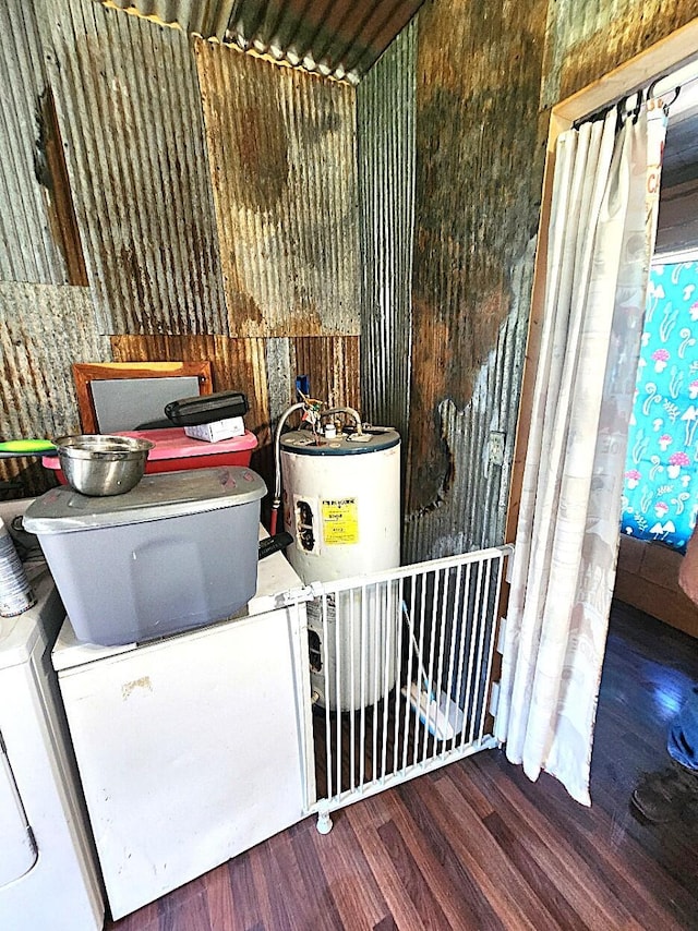 interior space with water heater and wood-type flooring