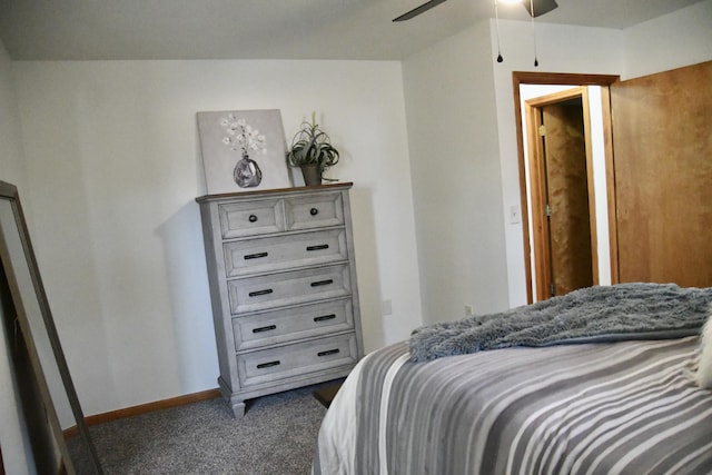 bedroom featuring ceiling fan and dark carpet