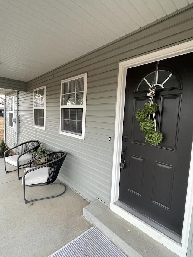 view of exterior entry featuring a porch