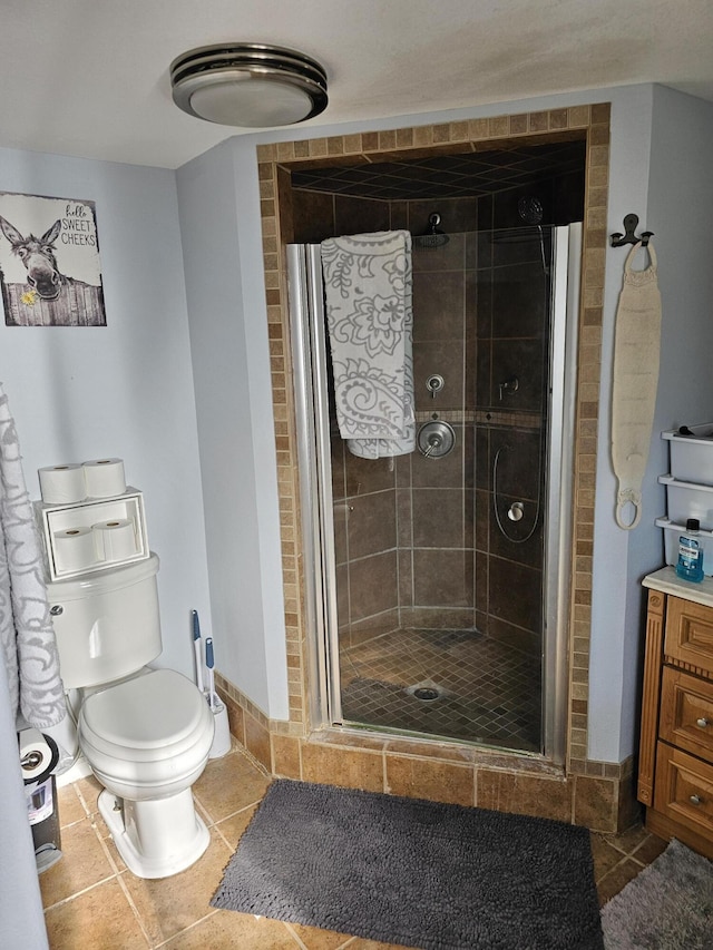 bathroom with an enclosed shower and toilet