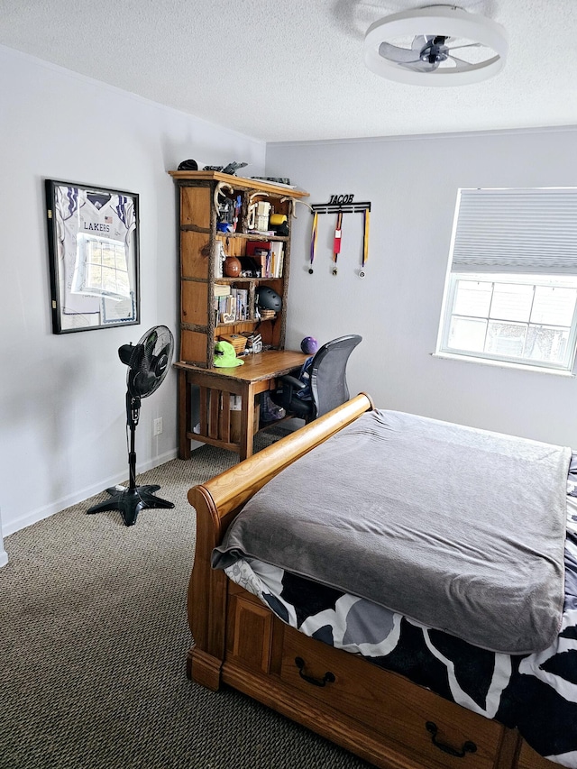 bedroom featuring carpet and a textured ceiling