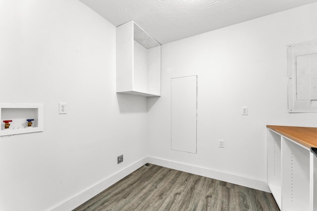 laundry room with dark wood-type flooring, washer hookup, and electric panel