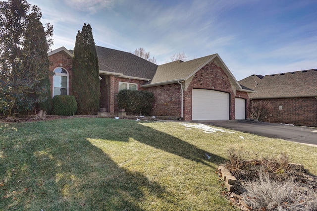 ranch-style home with a front yard and a garage